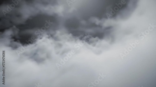 Ominous clouds blanket a monochrome sky