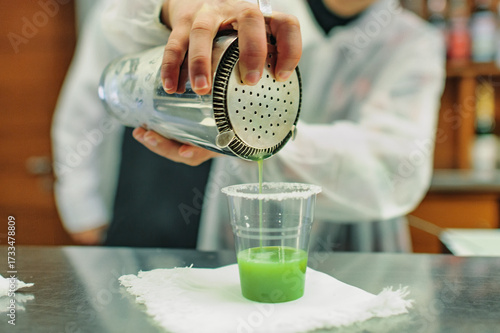 A cocktail poured into plastic glass