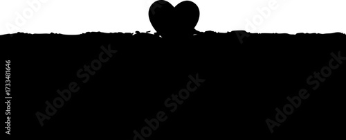 Elegant heart silhouette emerges from textured ground creating a romantic modern symbol of love and connection