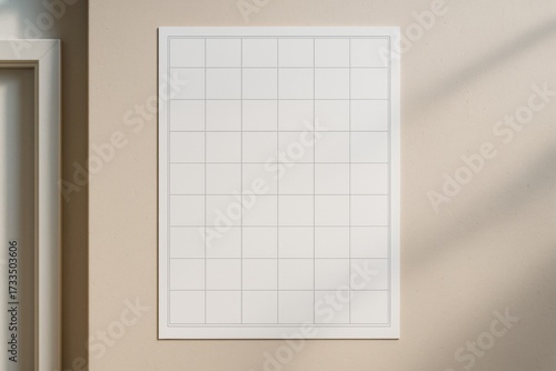Minimalist blank calendar poster mockup hanging on beige wall with soft shadows, clean grid layout design template for creative planning concepts. Ai generative