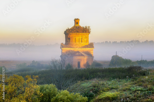 Abandoned church of Michael the Archangel in morning mist, Tula region