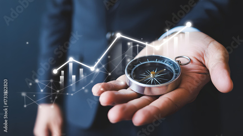Hand holding compass with stock graph overlaying the image