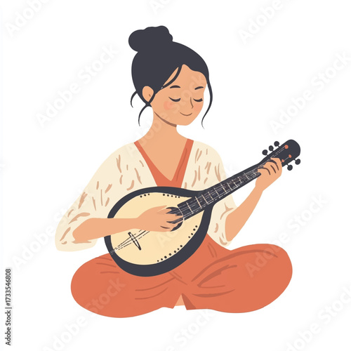 Woman serenely playing a mandolin while sitting cross legged with eyes closed.