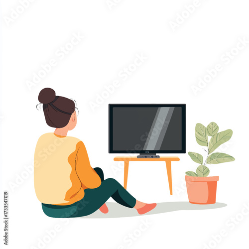 Woman sitting on the floor watching television in her living room