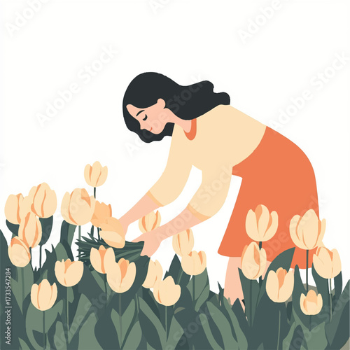 Woman tending to a field of yellow tulips.