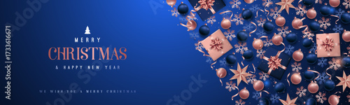 Merry Christmas greeting adorned with festive decorations in blue and rose gold. Horizontal Christmas header for website template, flat top view.