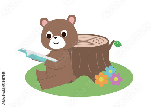 原っぱの切り株にもたれて読書しているクマさん