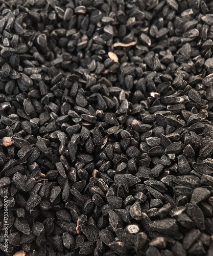 Natural background of Black Cumin seeds, Nigella sativa, ,close-up.