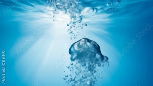 Rising Bubbles: Refreshing Underwater Close-Up of Air Bubbles Floating Upwards in Clear Blue Water