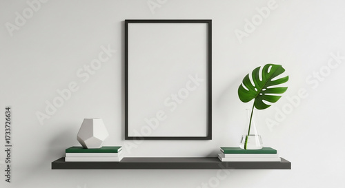 Blank picture frame and plant on modern floating shelf
