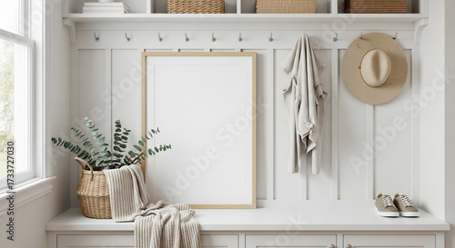 Blank picture frame leaning on white wall in modern home entryway