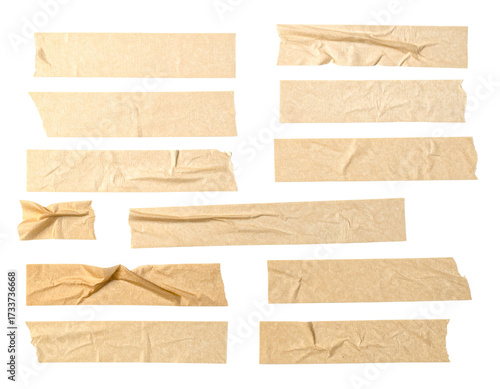 Various tan tape pieces arranged against a black background