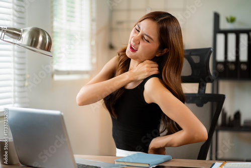 Women sitting at home office workplace gesture neck pain office syndrome concept. Free Download Women sitting at home office workplace gesture neck pain office syndrome concept. - GFXLoad