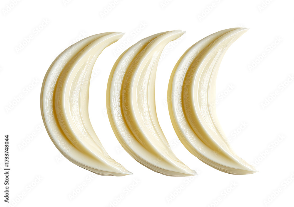 Fototapeta premium Three crescent-shaped, creamy-white objects, arranged vertically