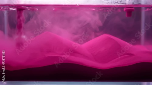 Vibrant Magenta Sand Dunes Form in Flowing Water