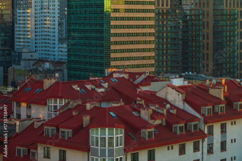 Warsaw skyscrapers between Żelazna Street and Grzybowska Street with residential rooftops in the foreground