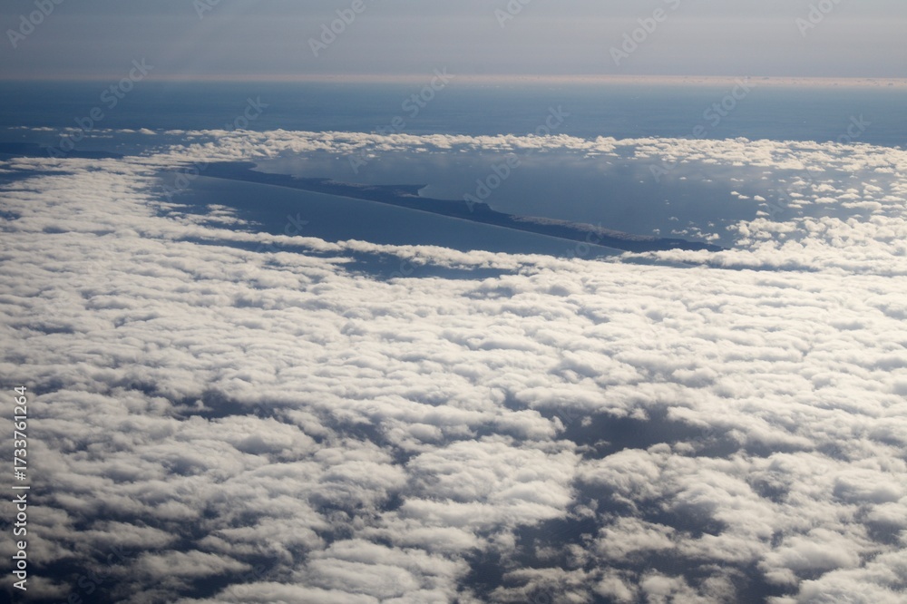 Obraz premium Clouds and snakes from an airplane