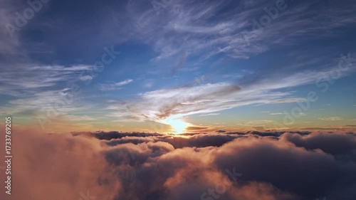 Breathtaking drone footage of sunrise above the clouds with golden light and dramatic skies, perfect for cinematic, travel, and inspirational projects.
