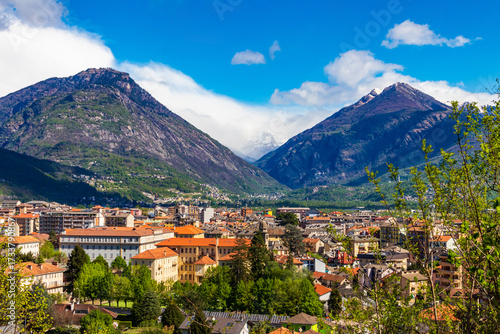 Aerial view of small town of Domodossola in Ossola valley surrounded by green Alps in Piedmont, Italy