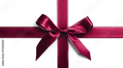 Christmas gift ribbon bow, burgundy with gold trim, on white background, top view, copy space