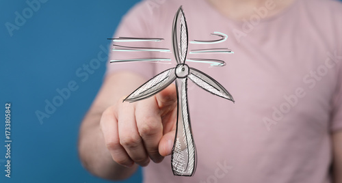 Hand pointing at a drawn wi...