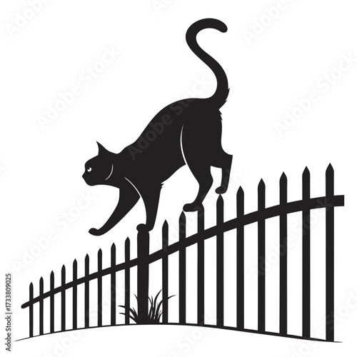 Black cat silhouette arching back on picket fence animal