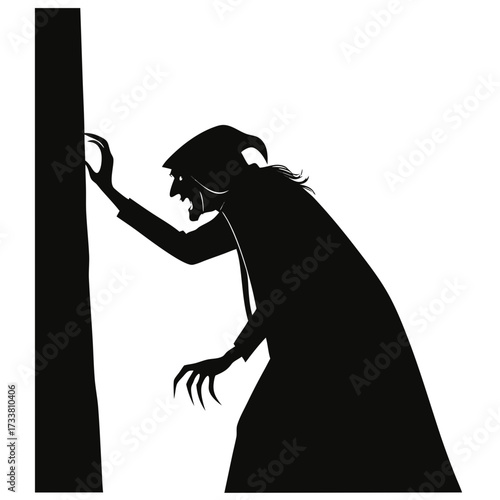 Black silhouette of a witch with claws reaching towards a tree