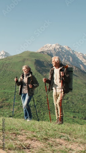 Wallpaper Mural Slow motion vertical video elderly couple hiking with poles in mountains active lifestyle wellness healthy aging fitness retirement outdoor activity freedom longevity wellbeing nature Torontodigital.ca