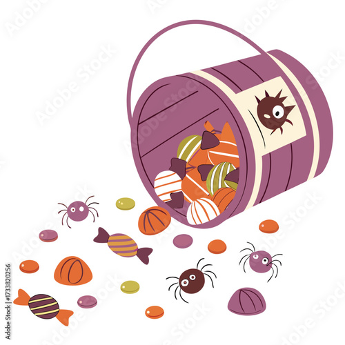 Halloween candy bucket spilling with treats and spiders