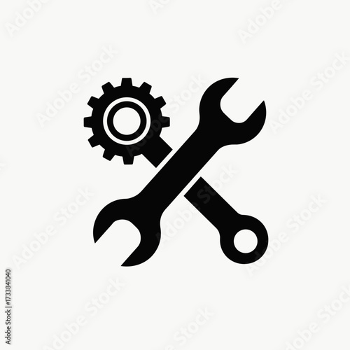 Isolated gear with wrench symbolizes mechanical work on white background. Isolated element includes spanner and cog, representing industrial maintenance, equipment repair.
