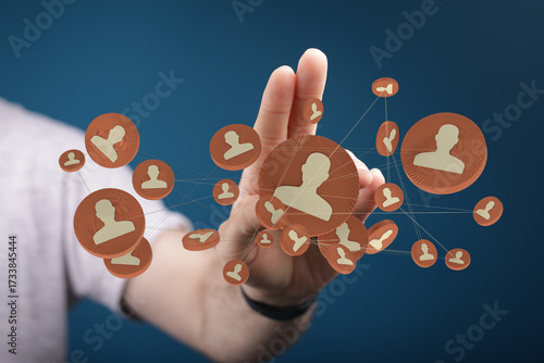 Network concept: A person reaching out to connect virtual people icons, symbolizing social network links and digital connections.