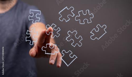 Hand interacts with puzzle ...