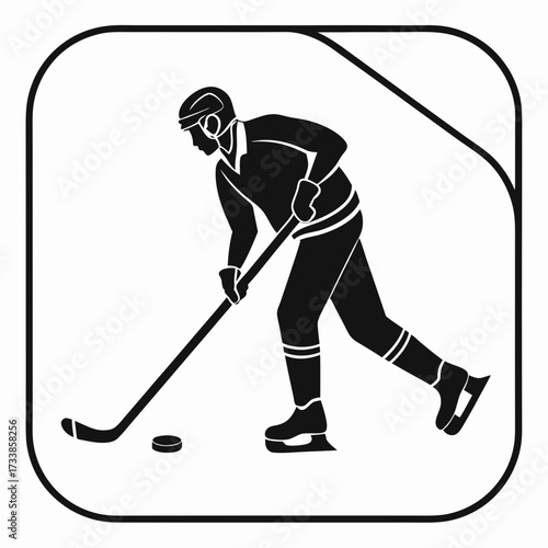 Black silhouette of hockey player with stick and puck