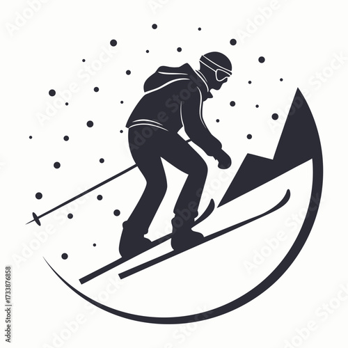 Silhouette of a skier descending a mountain slope skiing