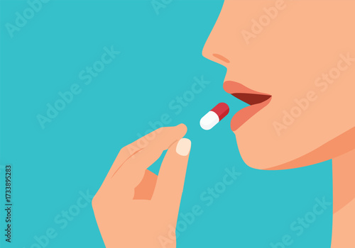 Woman taking pill into her mouth