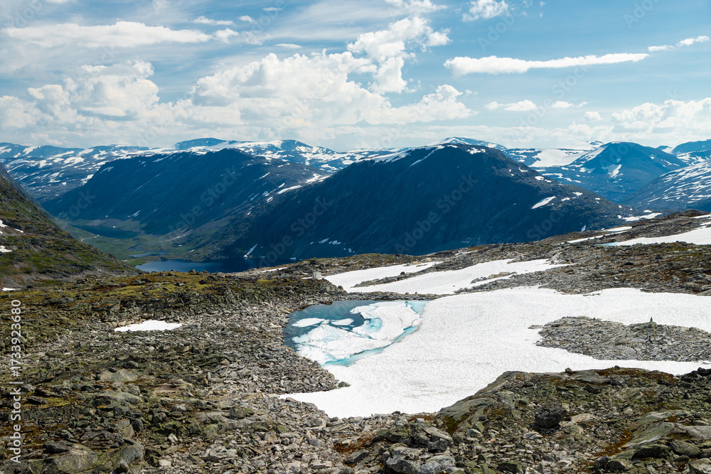 Obraz premium Views from the top of Dalsnibba which is Europe’s highest fjord viewpoint at 1500 meters of altitude, with spectacular views over Geiranger fjord and the village and the eternal snow fields