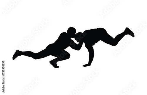 Dynamic silhouette of two wrestlers grappling in intense combat motion