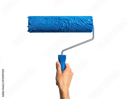A hand holding a paint roller covered in vibrant blue paint, ready for application