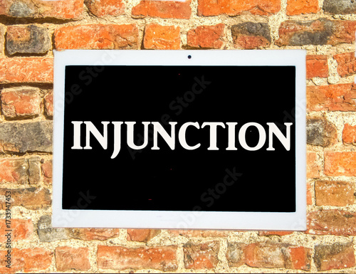 the word injunction on a digital tablet