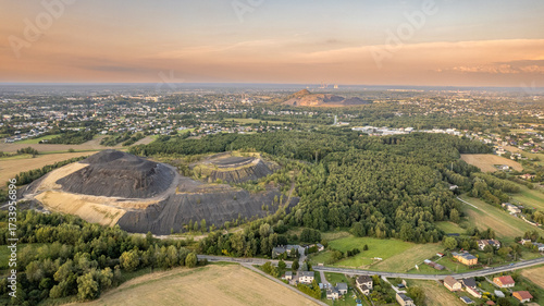 Aerial Panorama of Mining Waste Heaps and Countryside near Silesian Town at Sunset