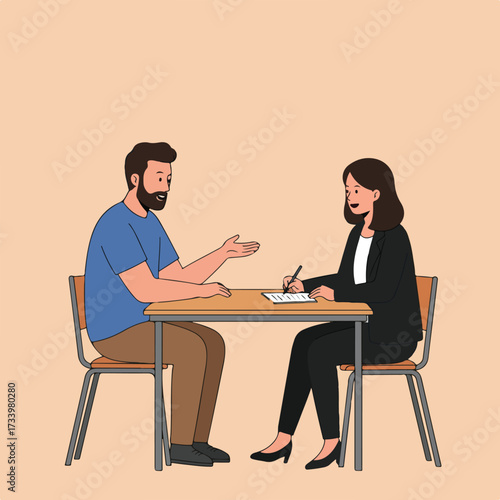 A man and woman sit at a table, one speaking, the other writing