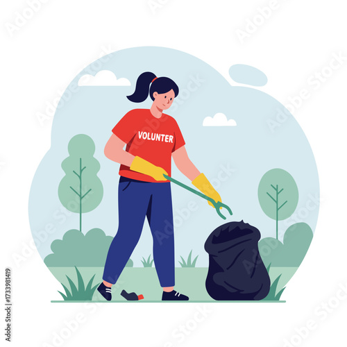 A volunteer cleans up litter in a park, filling a black garbage bag