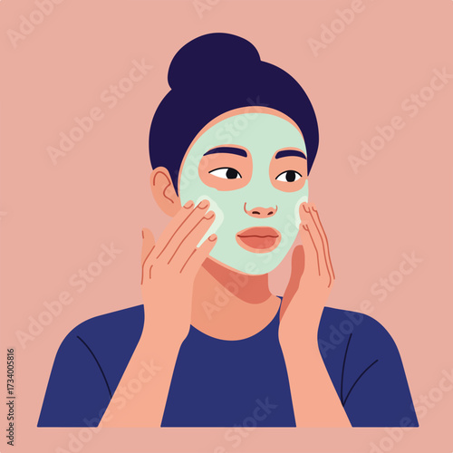Person applying a facial mask, gently touching cheeks for skincare