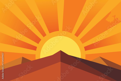 Sunburst over desert mountains at sunrise or sunset