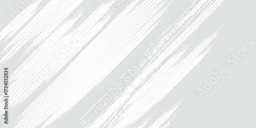 Abstract grunge brush with dotted halftone on gray background.