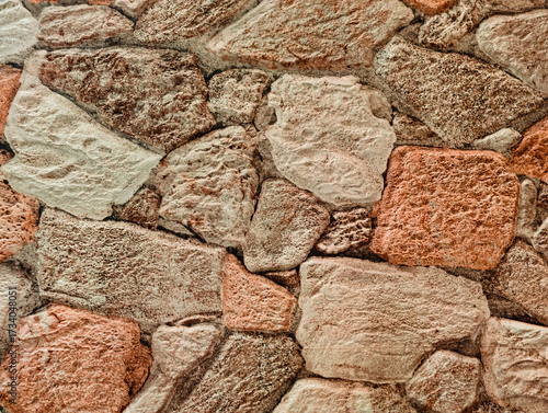 Schilderij op canvas Natural Beige Brown Stone Wall Texture - Rustic Rock Pattern Background with Terracotta Accents for Design Projects