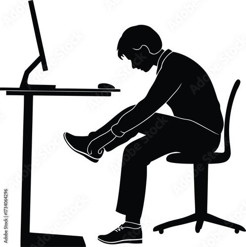 Man sitting at desk adjusting shoes silhouette