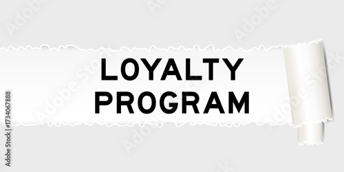 Ripped gray paper background that have word loyalty program under torn part