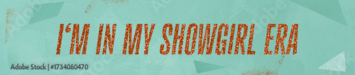 Photos 'I'm in my showgirl era' written in orange glitter font, ultra wide format, oran