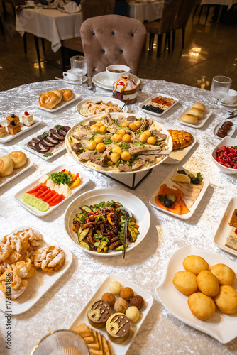 Festive banquet table with traditional dishes top view